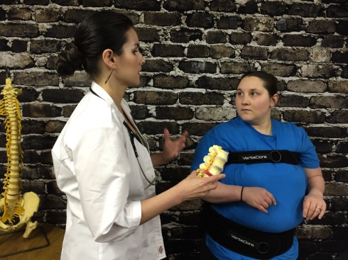 Chiropractor Explaining How a VerteCore Lift Can Help Overweight Patients